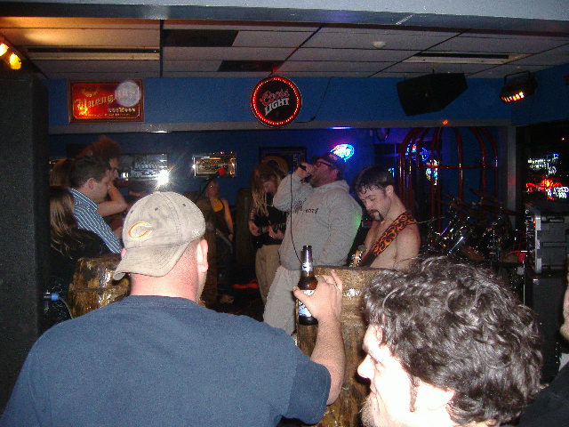 I'm not sure what the deal is but this guy only backed up a couple songs. The way he would scream lyrics always reminded me of some of the oldtime hardcore punk bands. By the way, as promised our friend from Lamps Burning was right up front checking out Hard$ell, he's behind the guy in the blue striped shirt.